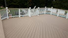 custom brownstone azek upper deck to pool with herringbone floor pattern