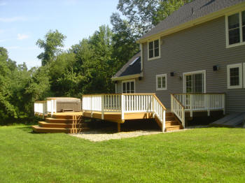 large ipe deck with hot tub and stadium stairs