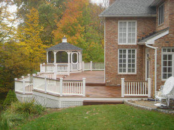 large ipe deck in avon ct with king posts and vinyl rails