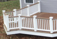 trex deck with white vinyl rails and kingposts