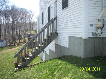 unuseable back yard sloping yard composite deck before